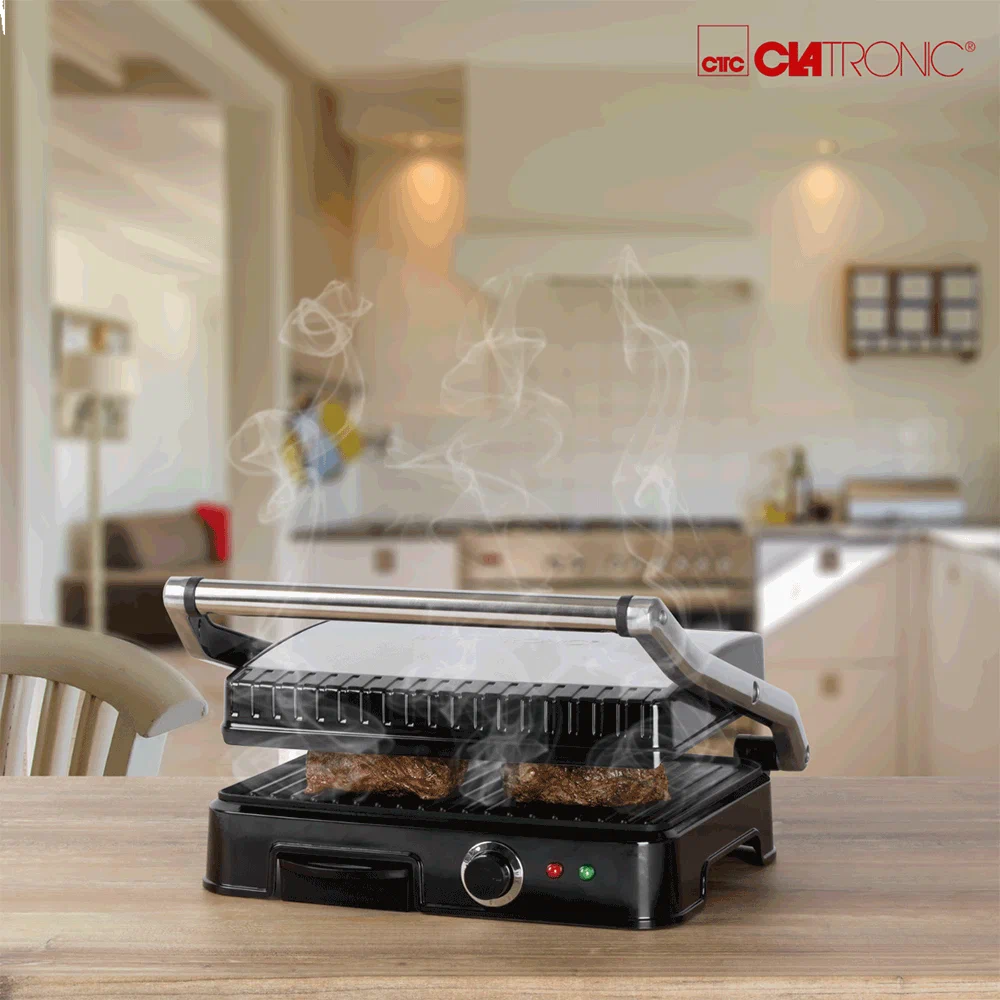 Clatronic KG 3487 электрогриль в работе — мясо на рифлёной решётке с паром